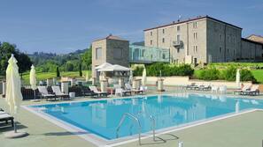 Indoor pool, outdoor pool, pool umbrellas, pool loungers