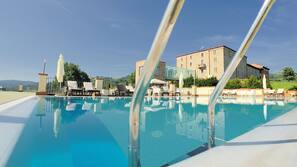 Indoor pool, outdoor pool, pool umbrellas, pool loungers