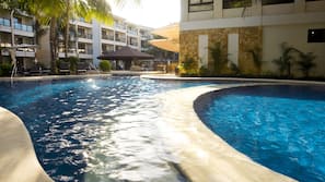 2 outdoor pools, open 8:00 AM to 10:00 PM, pool umbrellas, sun loungers