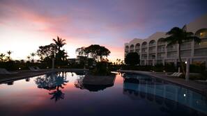 Outdoor pool, open 9:00 AM to 7:00 PM, pool umbrellas