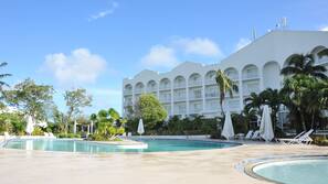Outdoor pool, open 9:00 AM to 7:00 PM, pool umbrellas