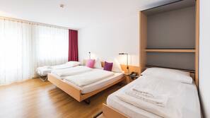 Luxe beddengoed, een minibar, een kluis op de kamer, een bureau