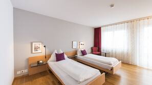 Luxe beddengoed, een minibar, een kluis op de kamer, een bureau