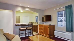Desk, iron/ironing board, bed sheets