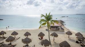 On the beach, sun loungers, beach umbrellas, beach towels