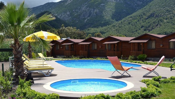 Outdoor pool, pool umbrellas, sun loungers