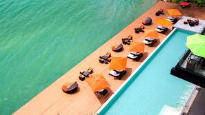 Outdoor pool, open 8 AM to 7 PM, pool umbrellas, sun loungers