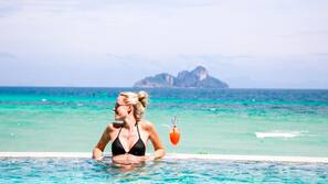 Outdoor pool, open 8 AM to 7 PM, pool umbrellas, sun loungers
