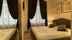 Minibar, coffre-forts dans les chambres, bureau, rideaux occultants