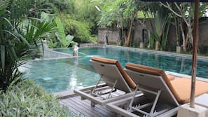 Indoor pool, outdoor pool, pool umbrellas