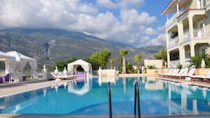 Seasonal outdoor pool, pool umbrellas, pool loungers