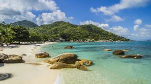 On the beach, white sand, beach towels