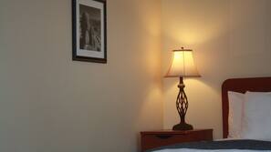 Desk, laptop workspace, blackout drapes, iron/ironing board