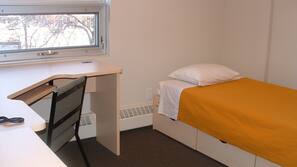Desk, laptop workspace, blackout drapes, iron/ironing board