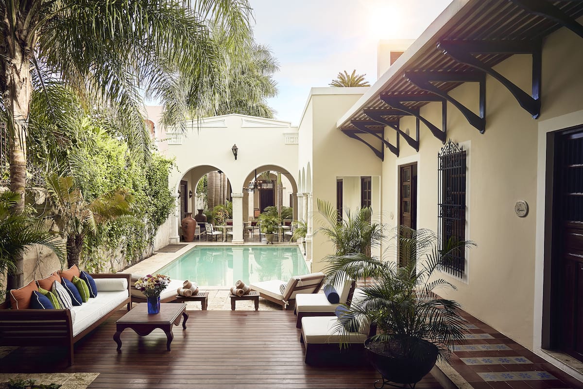best hotels in merida mexico | kuka y naranjo boutique hotel pool and lounging area