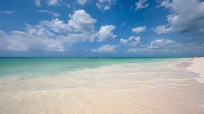 On the beach, sun-loungers, beach umbrellas, beach towels