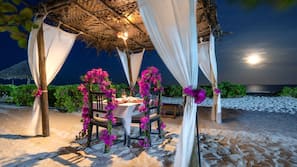 On the beach, sun-loungers, beach umbrellas, beach towels