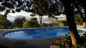 Seasonal outdoor pool, open 8 AM to 8 PM, pool loungers