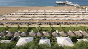Private beach, beach umbrellas, beach towels, beach volleyball