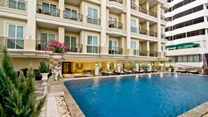 Outdoor pool, open 7 AM to 7 PM, pool umbrellas, sun loungers