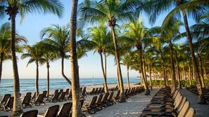 On the beach, white sand, free beach cabanas, sun loungers