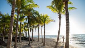 On the beach, white sand, free beach cabanas, sun loungers