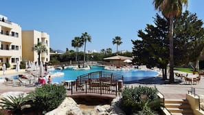 Indoor pool, outdoor pool, pool umbrellas