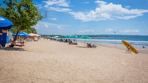 Beach nearby, white sand, beach cabanas, beach towels