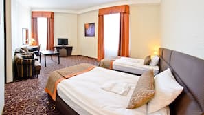 Ropa de cama hipoalergénica, minibar, caja fuerte y escritorio