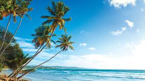 On the beach, white sand, free beach cabanas, sun loungers