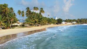 On the beach, white sand, free beach cabanas, sun loungers