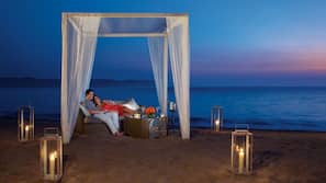 On the beach, sun loungers, beach umbrellas, beach towels