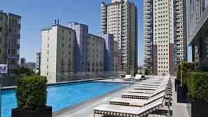 Indoor pool, outdoor pool, pool umbrellas, pool loungers