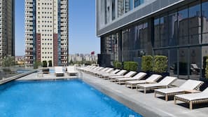 Indoor pool, outdoor pool, pool umbrellas, pool loungers
