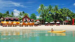 On the beach, sun-loungers, beach umbrellas, beach towels