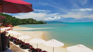 On the beach, sun-loungers, beach umbrellas, beach towels