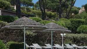 Seasonal outdoor pool, open 9:00 AM to 7:00 PM, pool umbrellas