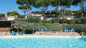 Seasonal outdoor pool, open 9:00 AM to 7:00 PM, pool umbrellas