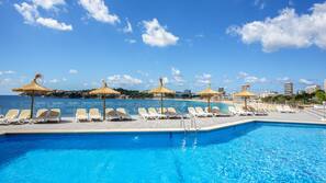 Seasonal outdoor pool, open 10:00 AM to 8:00 PM, pool umbrellas