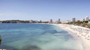 On the beach, white sand, beach towels