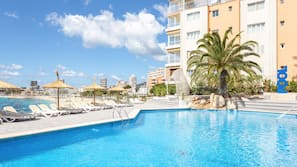Seasonal outdoor pool, open 10:00 AM to 8:00 PM, pool umbrellas