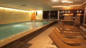 Indoor pool, open 8:00 AM to 10:00 PM, pool loungers
