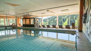 Indoor pool, open 8:00 AM to 10:00 PM, pool loungers
