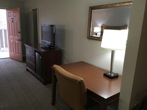 Desk, laptop workspace, blackout drapes, iron/ironing board