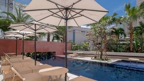 Seasonal outdoor pool, open 10:00 AM to 8:00 PM, free pool cabanas