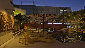 Seasonal outdoor pool, open 10:00 AM to 8:00 PM, free pool cabanas