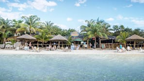 On the beach, white sand, free beach cabanas, sun-loungers