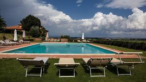 Seasonal outdoor pool, pool loungers