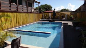 Outdoor pool, pool umbrellas, sun loungers