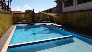 Outdoor pool, pool umbrellas, sun loungers